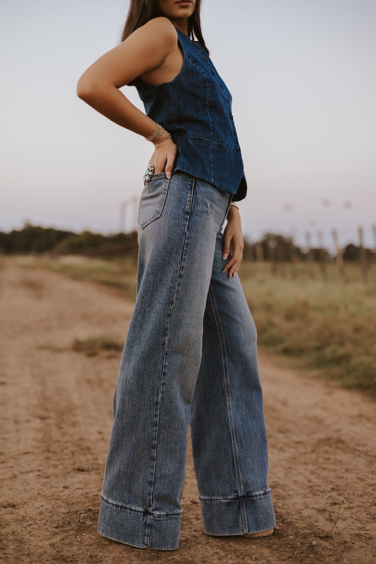 Women’s medium wash jeans from Western Vogue Boutique, stylish denim bottoms with classic fit and fading details