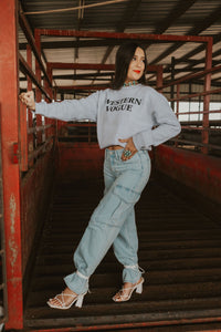 Women’s Denton Denim Cargo Jeans by Western Vogue Boutique, showcasing stylish blue denim with multiple cargo pockets.