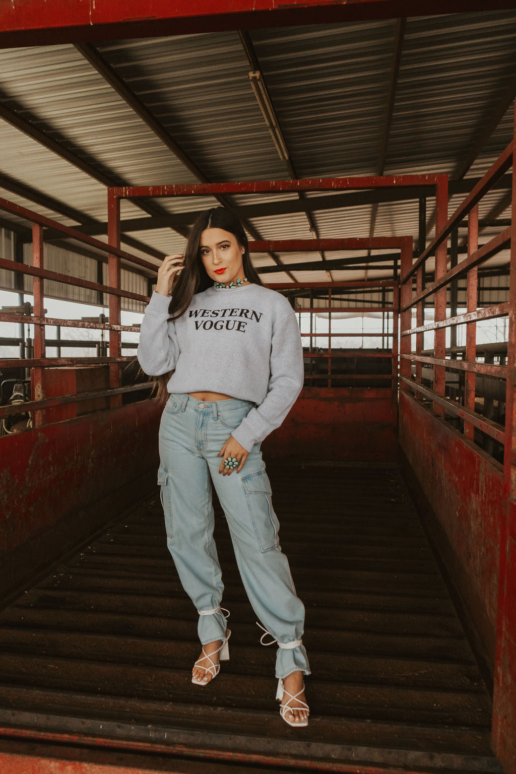 Women’s denim cargo jeans from Western Vogue Boutique featuring a relaxed fit and functional pockets.