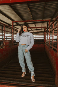 Women’s denim cargo jeans from Western Vogue Boutique featuring a relaxed fit and functional pockets.