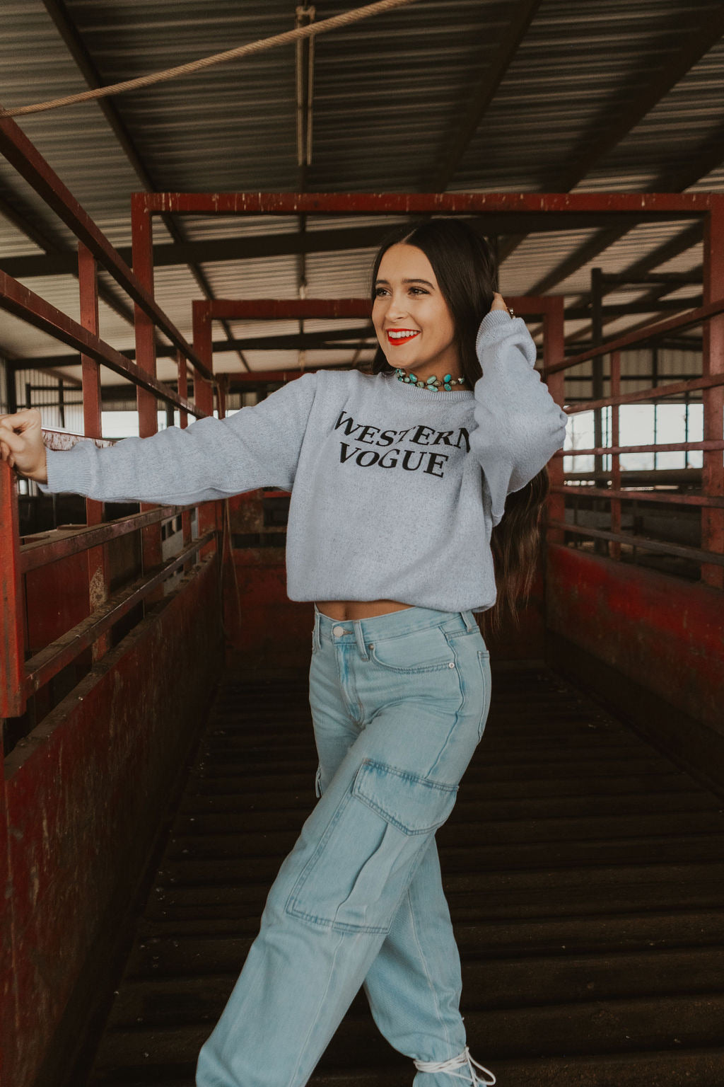 Women’s blue denim cargo jeans from The Denton collection by Western Vogue Boutique, featuring a relaxed fit and multiple pockets.