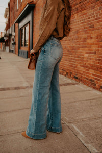 Western Vogue Boutique Happi Jeans 31, stylish denim bottoms with classic fit and fading detail, displayed on a neutral background.