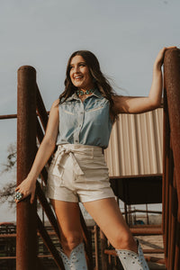 White creamy shorts from Western Vogue Boutique, stylish bottoms with a comfortable fit and modern design.