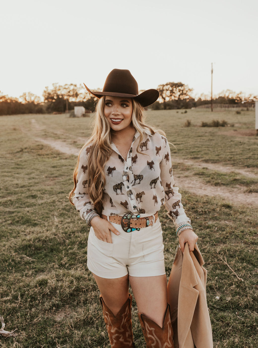 White creamy shorts from Western Vogue Boutique, casual bottoms with a relaxed fit and stylish design displayed on the model.
