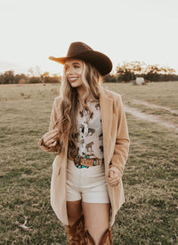 Creamy white shorts from Western Vogue Boutique, stylish bottoms with a relaxed fit and soft fabric, perfect for casual wear.