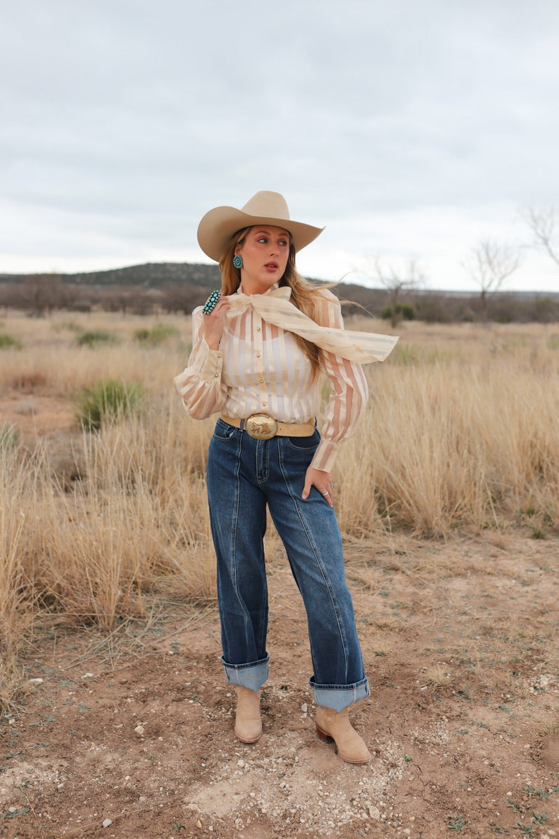Women’s denim jeans from Western Vogue Boutique, Macon style, showcasing classic blue bottoms with a relaxed fit.