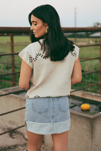 Western Vogue Boutique's Thoroughbred Sweater Vest, a stylish outerwear piece with a classic design and cozy knit fabric.