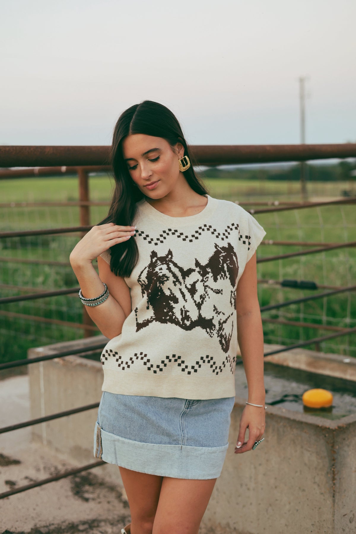 Western Vogue Boutique Thoroughbred Sweater Vest, cozy outerwear with a classic design, shown in a close-up image.