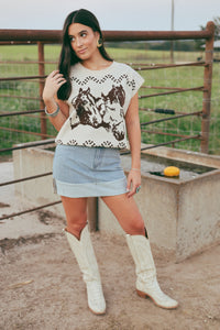 Western Vogue Boutique Thoroughbred Sweater Vest, stylish outerwear with a classic knit design and ribbed edges.