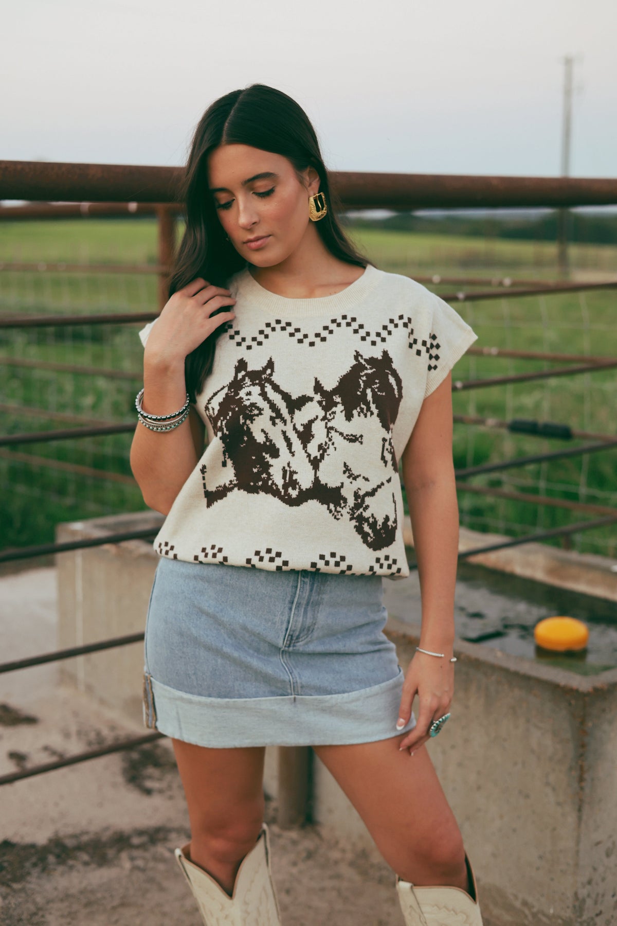 Western Vogue Boutique's The Thoroughbred Sweater Vest, cozy outerwear in a classic design, displayed on a neutral background.