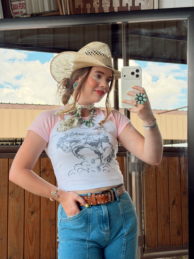 Women's Western Vogue Boutique Cowboy Doodle T-Shirt featuring a playful cowboy doodle graphic on a casual top.