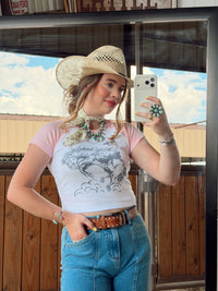The Cowboy Doodle Women's T-Shirt from Western Vogue Boutique featuring a casual, stylish top with cowboy-themed graphic design.