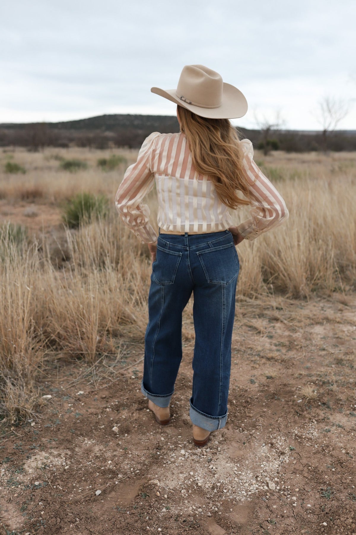 Cream striped bow summer top from Western Vogue Boutique, featuring a stylish design and lightweight fabric.