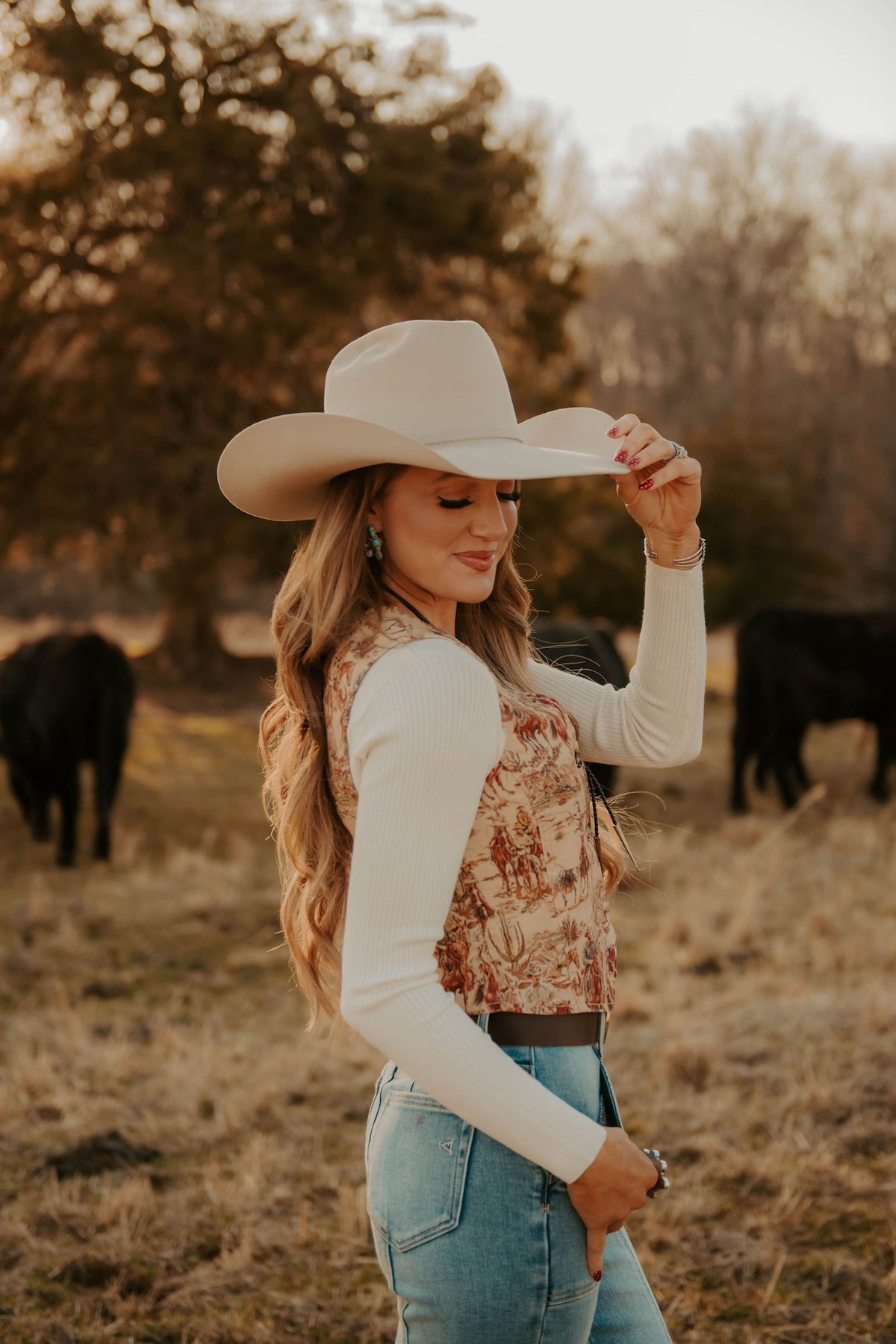 Women's Deadwood vest by Western Vogue Boutique, stylish Western tops with leather accents and detailed stitching.