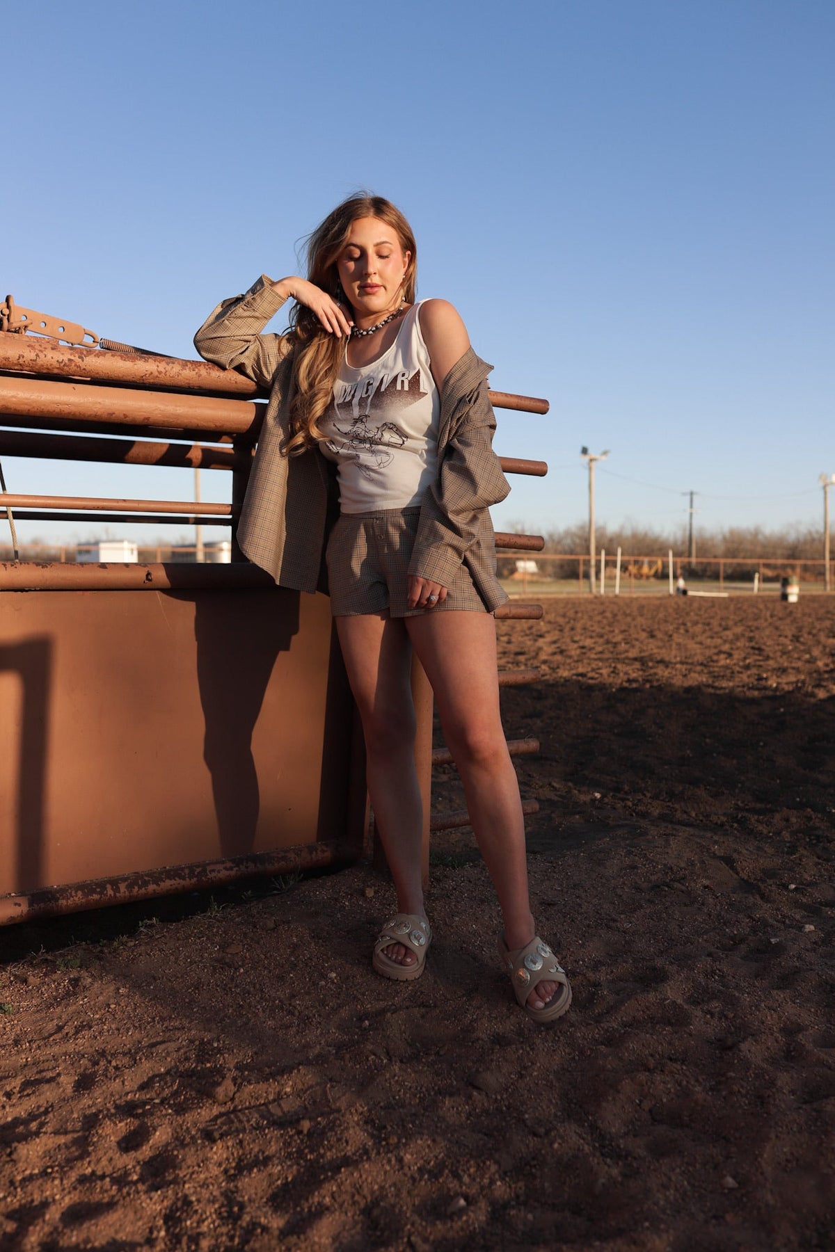 Western Vogue Boutique cowgirl tank top featuring Western horse graphic, sleeveless design, casual Western-inspired style.