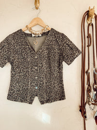 Leopard print denim top from Western Vogue Boutique, stylish long sleeve shirt with button front and casual fit.