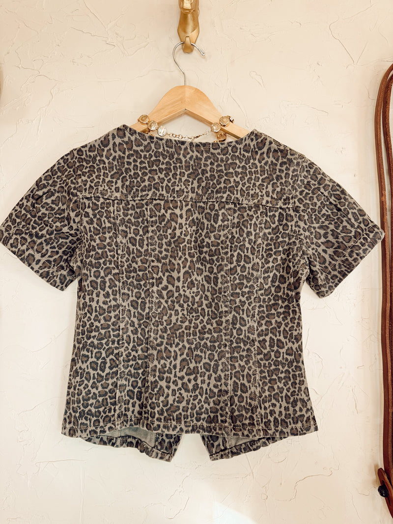 Leopard print denim top from Western Vogue Boutique featuring a stylish, casual design with long sleeves and a fitted silhouette.