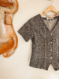 Leopard print denim top from Western Vogue Boutique featuring long sleeves and a casual, stylish fit.