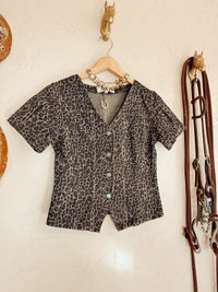 Western Vogue Boutique Logan Leopard Denim Top, casual long-sleeve shirt with leopard print and denim fabric, styled for everyday wear.