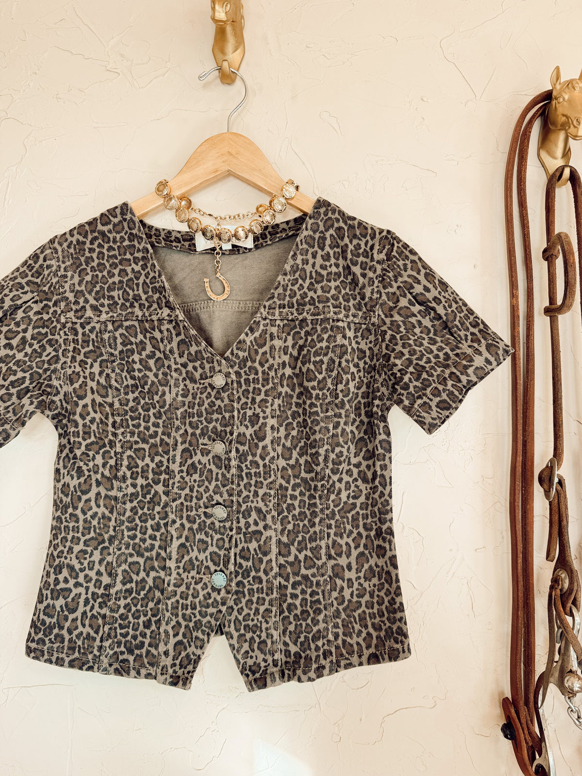 Leopard print denim top from Western Vogue Boutique featuring long sleeves and a casual fit.