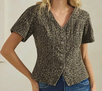Leopard print denim top from Western Vogue Boutique, featuring a stylish, fitted design with long sleeves and button-front detail.