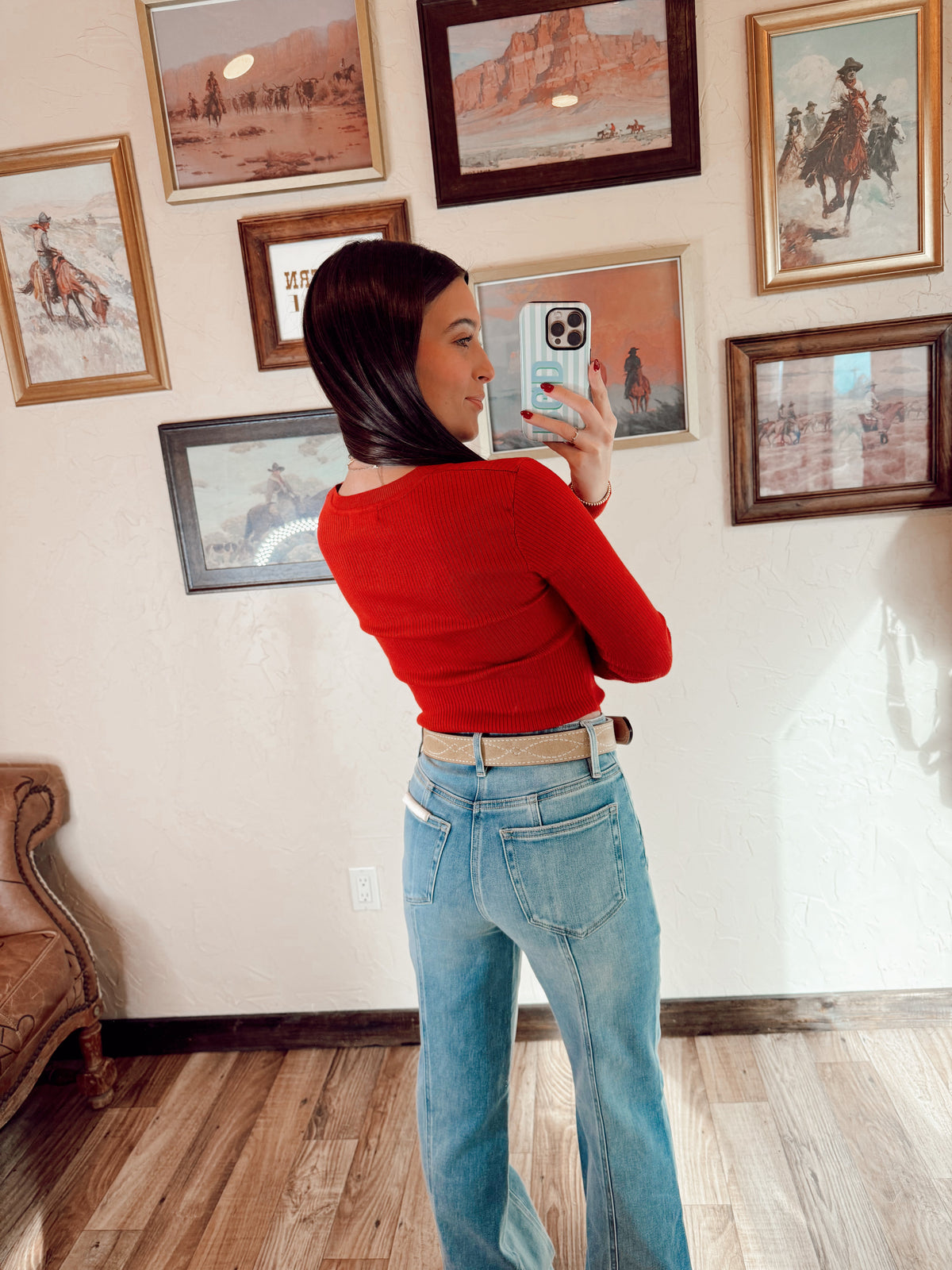 Red Sloan Top by Western Vogue Boutique, featuring a stylish, fitted blouse with a V-neck and long sleeves.