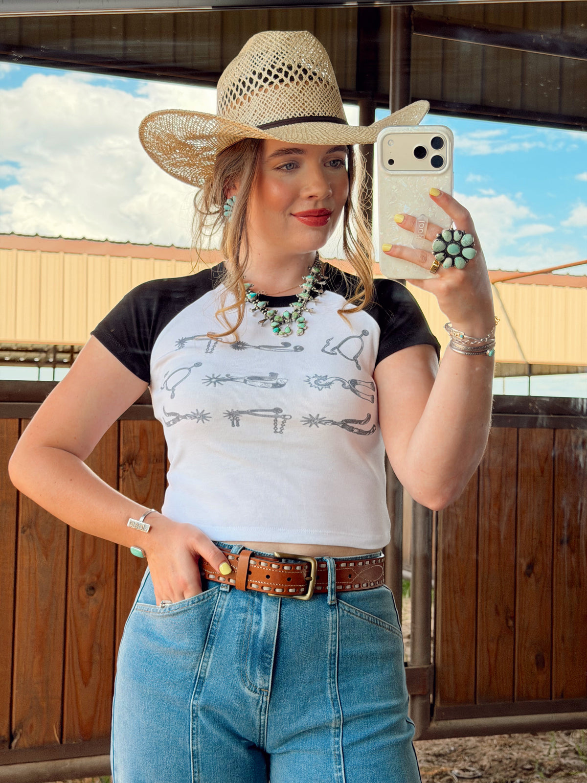 Western Vogue Boutique Spurs Women's T-Shirt, casual top with Western-inspired design, displayed on a neutral background.