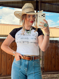 Western Vogue Boutique Spurs Women's T-Shirt, casual top with Western-inspired design, displayed on a neutral background.