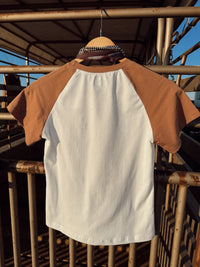 Western Vogue Boutique The Stampede Horses T-Shirt featuring a vibrant cowboy horse design on a casual top.