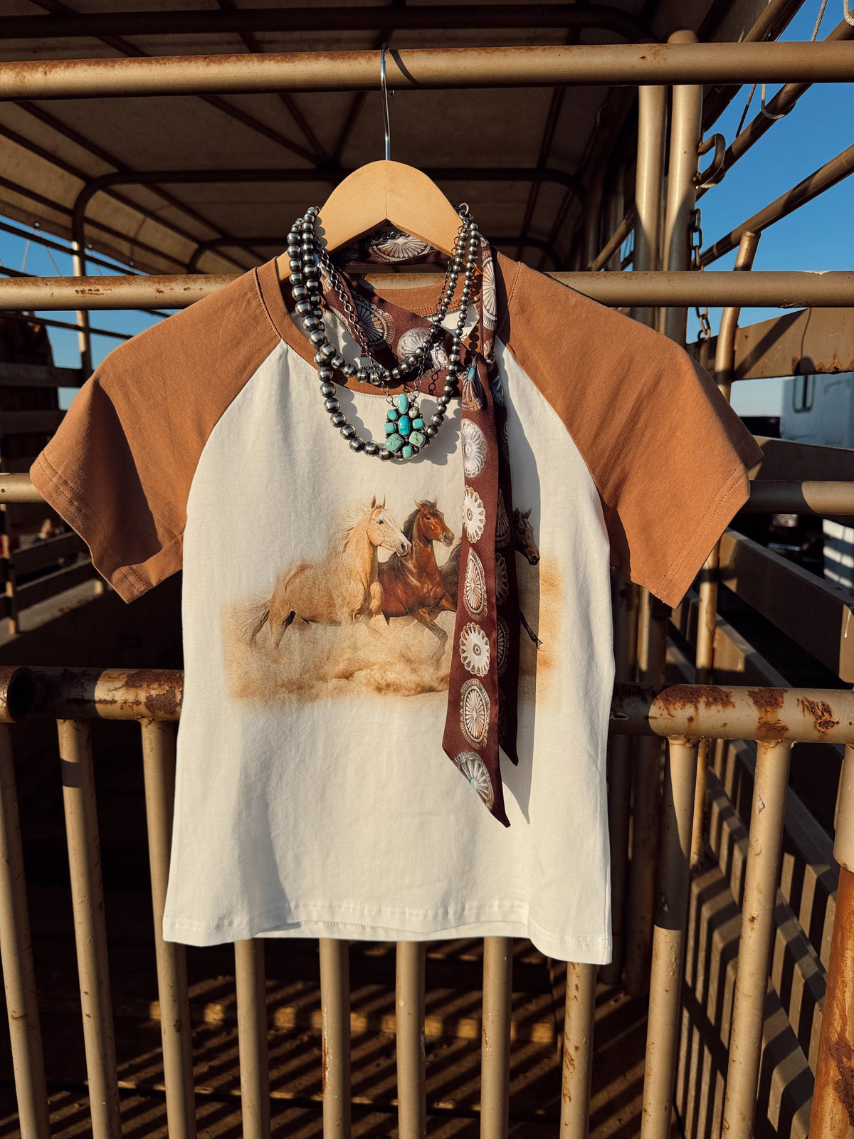Western Vogue Boutique The Stampede Horses T-Shirt, casual western-style top with horse graphic design, soft cotton fabric.