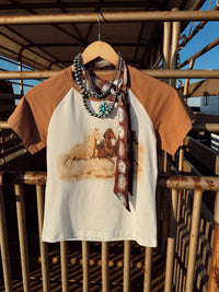 Western Vogue Boutique The Stampede Horses T-Shirt, casual western-style top with horse graphic design, soft cotton fabric.