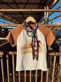 Western Vogue Boutique The Stampede Horses T-Shirt, casual top featuring a horse stampede graphic on soft fabric.