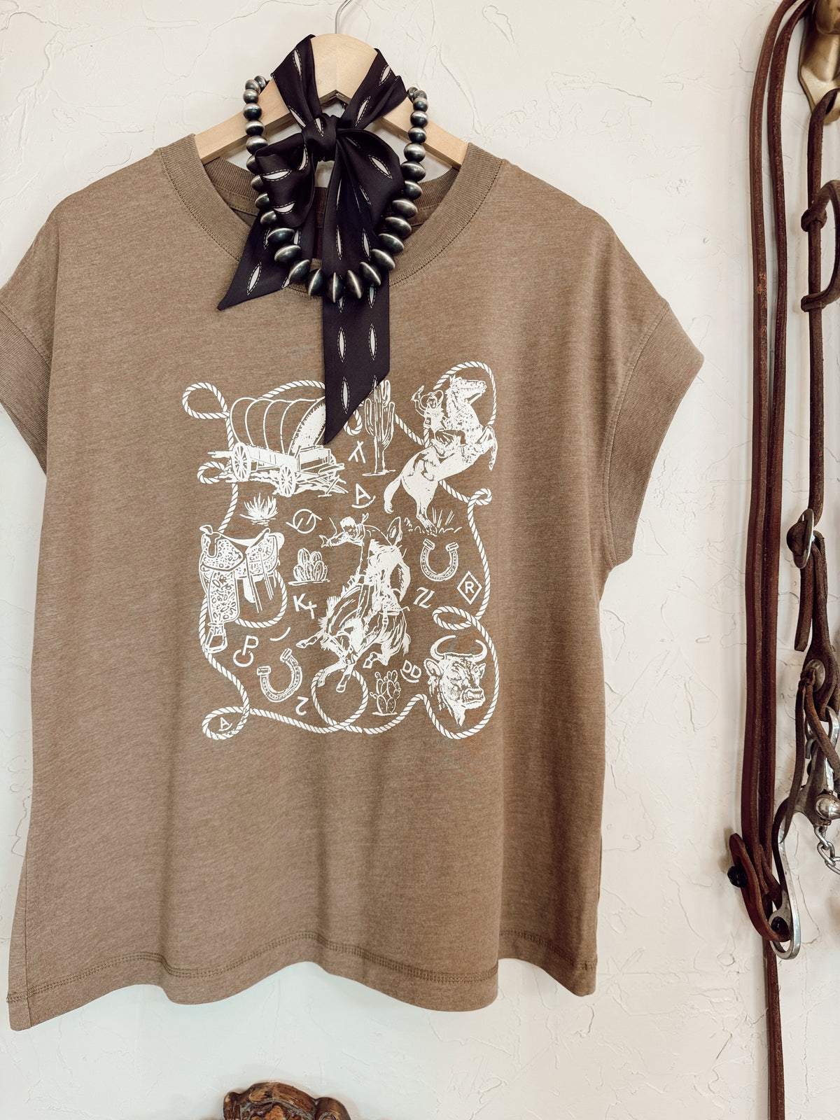 Western Vogue Boutique Western Icons T-Shirt, casual top with Western-inspired design, displayed flat on a neutral background.