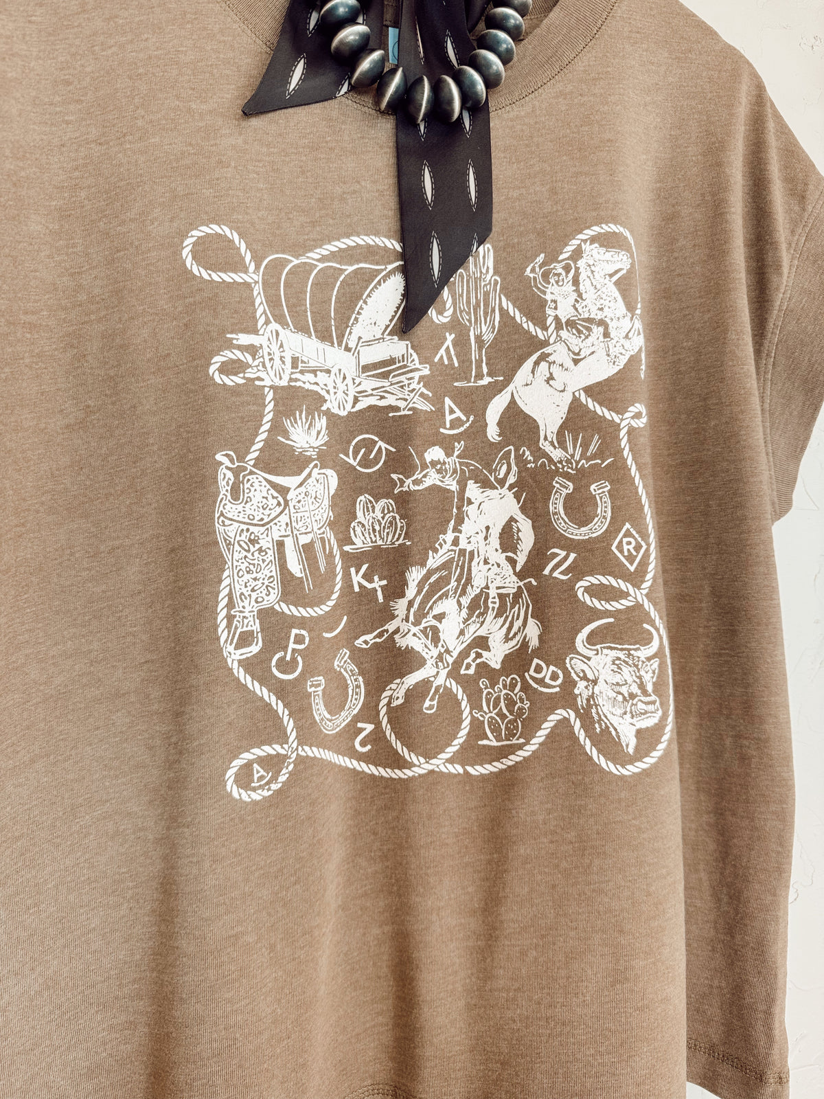 Western Vogue Boutique Western Icons T-Shirt featuring western-inspired graphic design, casual fit, and soft fabric for everyday wear.