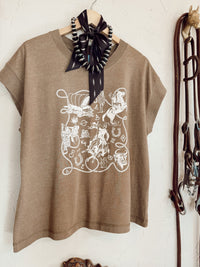 Western Vogue Boutique Western Icons T-Shirt featuring a stylish western-themed graphic on a casual top.