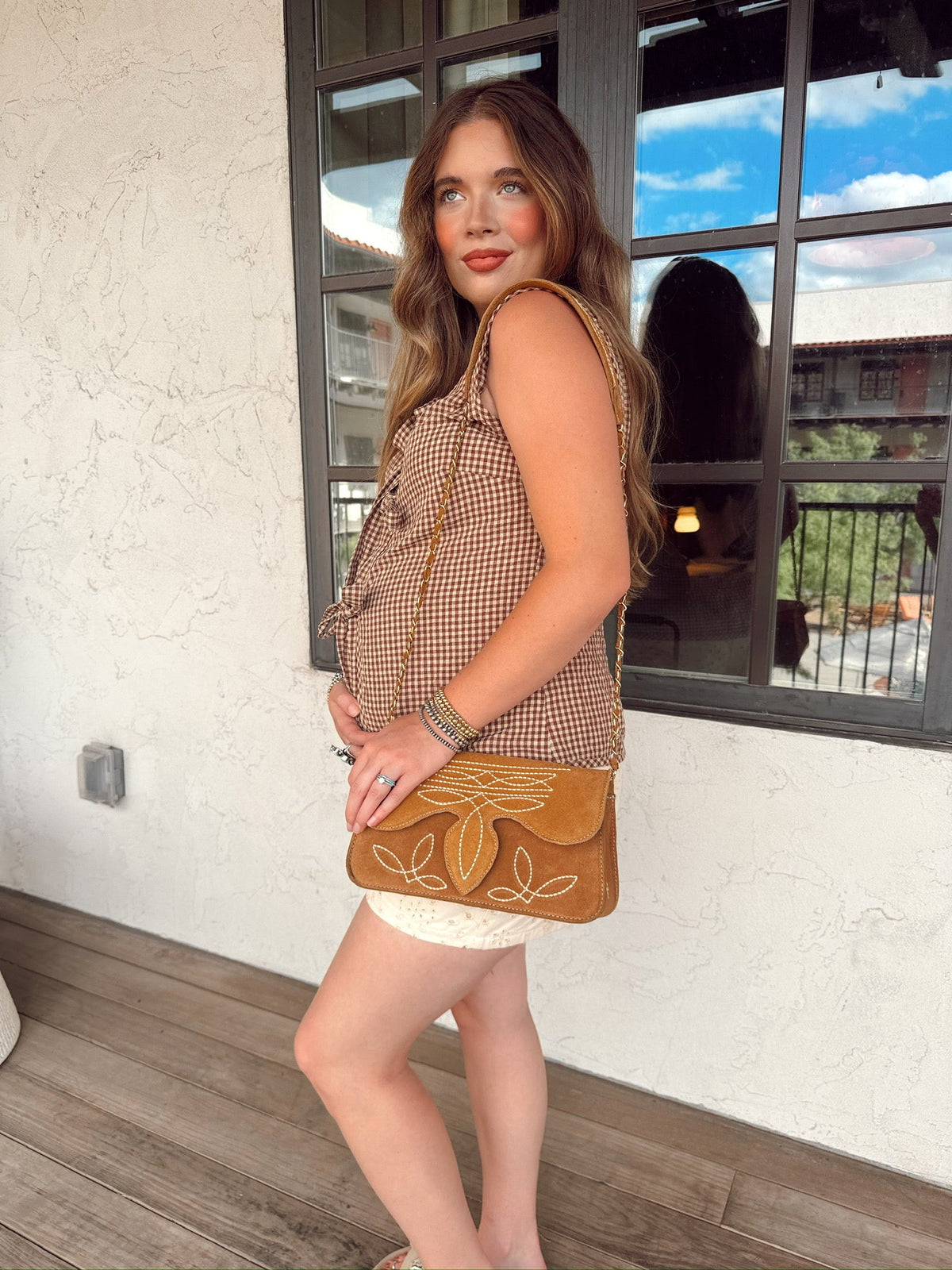 Western Vogue Boutique Wild West Girl vest, stylish western-themed sleeveless top with embroidery and fringe details.