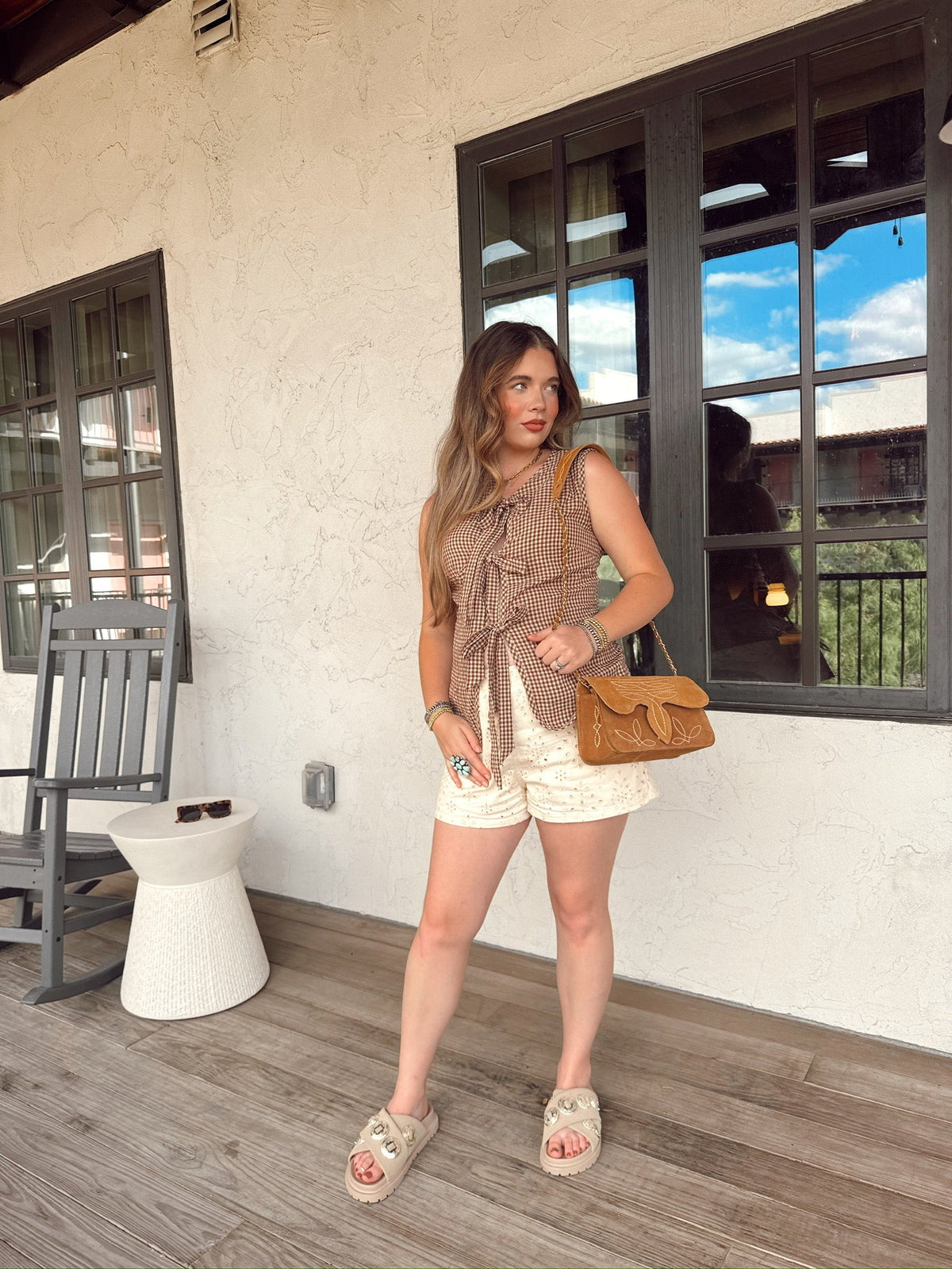 Western Vogue Boutique Wild West Girl vest, stylish western-inspired top with fringe and embroidery, displayed on a model.
