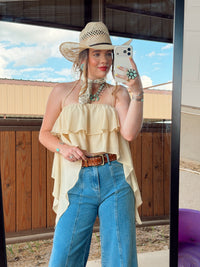 Bryn Luxe Cascade Halter top by Western Vogue Boutique, white sleeveless blouse with draped cascade design and halter neckline.
