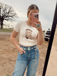 Women's cowgirl boot-themed top by Western Vogue Boutique, featuring western-inspired design and casual style.