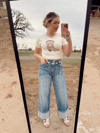 Women's cowgirl boot top from Western Vogue Boutique, stylish Western-inspired top with Western boot design, perfect for casual wear.