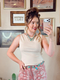 Cream women's Bedford top by Western Vogue Boutique, soft fabric, stylish fit, and classic design perfect for casual wear.
