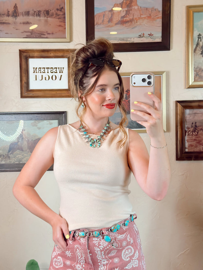 Cream women's top from Western Vogue Boutique featuring a stylish, fitted design with soft fabric and elegant neckline.