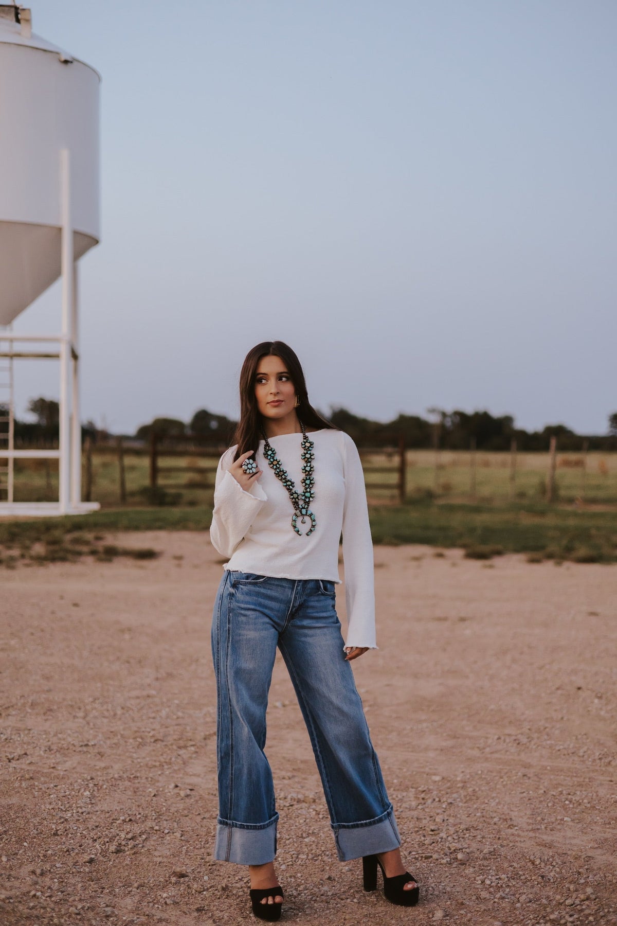 Western Vogue Boutique Bellaire Sweater, stylish women's top in soft knit fabric, displayed on a hanger.