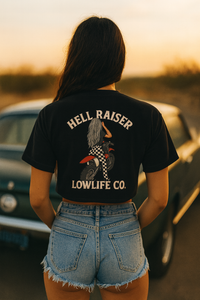 Wild Cactus Boutique Hell Raiser Crop top featuring a stylish crop design with bold lettering, displayed on a hanger.