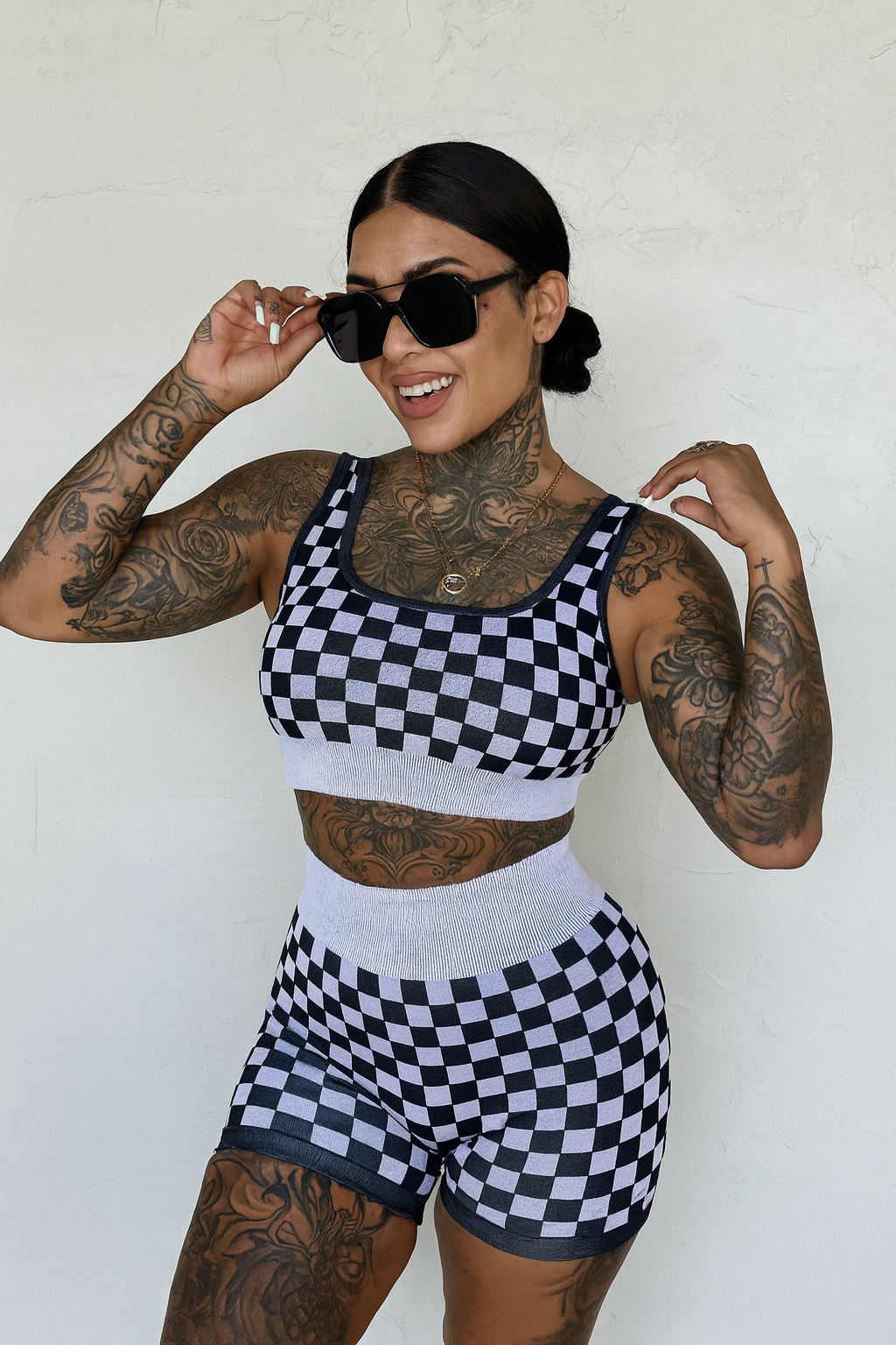 Peach and beige checkered women's gym set from Wild Cactus Boutique, activewear with sports bra and matching leggings.