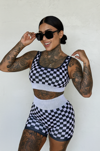 Peach and beige checkered women's gym set from Wild Cactus Boutique, activewear with sports bra and matching leggings.
