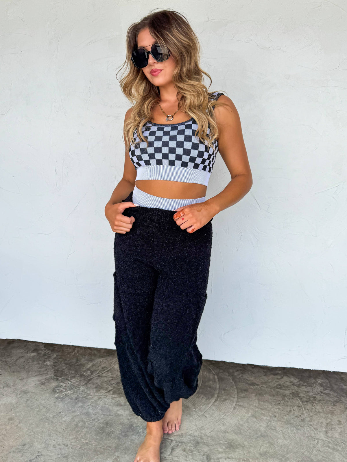 Checkered women's gym set by Wild Cactus Boutique featuring peachy beige and white activewear for workouts and active leisure.