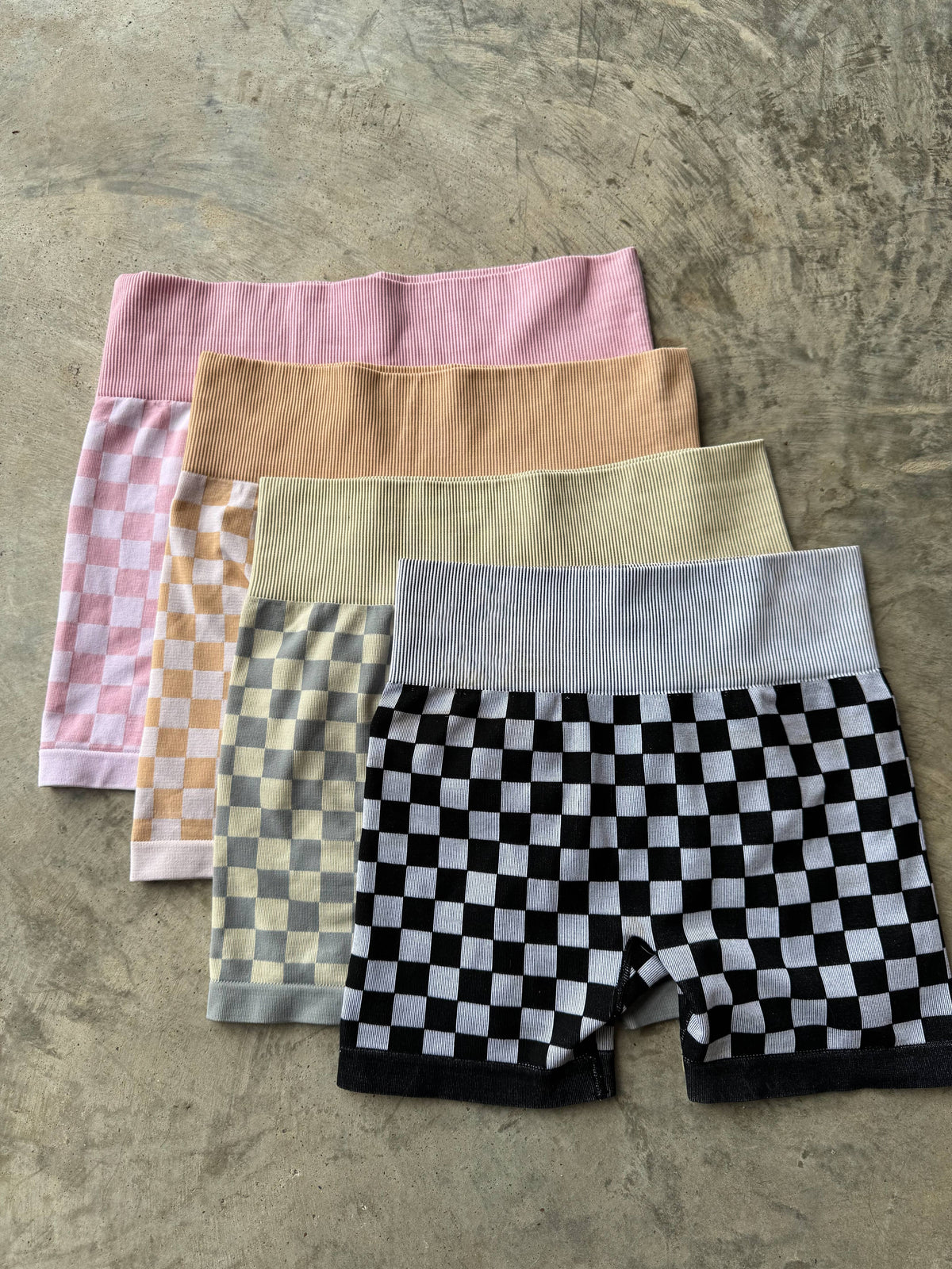 Peach and beige checkered women's gym set by Wild Cactus Boutique, activewear for workout and fitness activities.