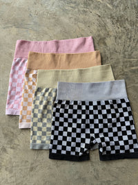 Peach and beige checkered women's gym set by Wild Cactus Boutique, activewear for workout and fitness activities.