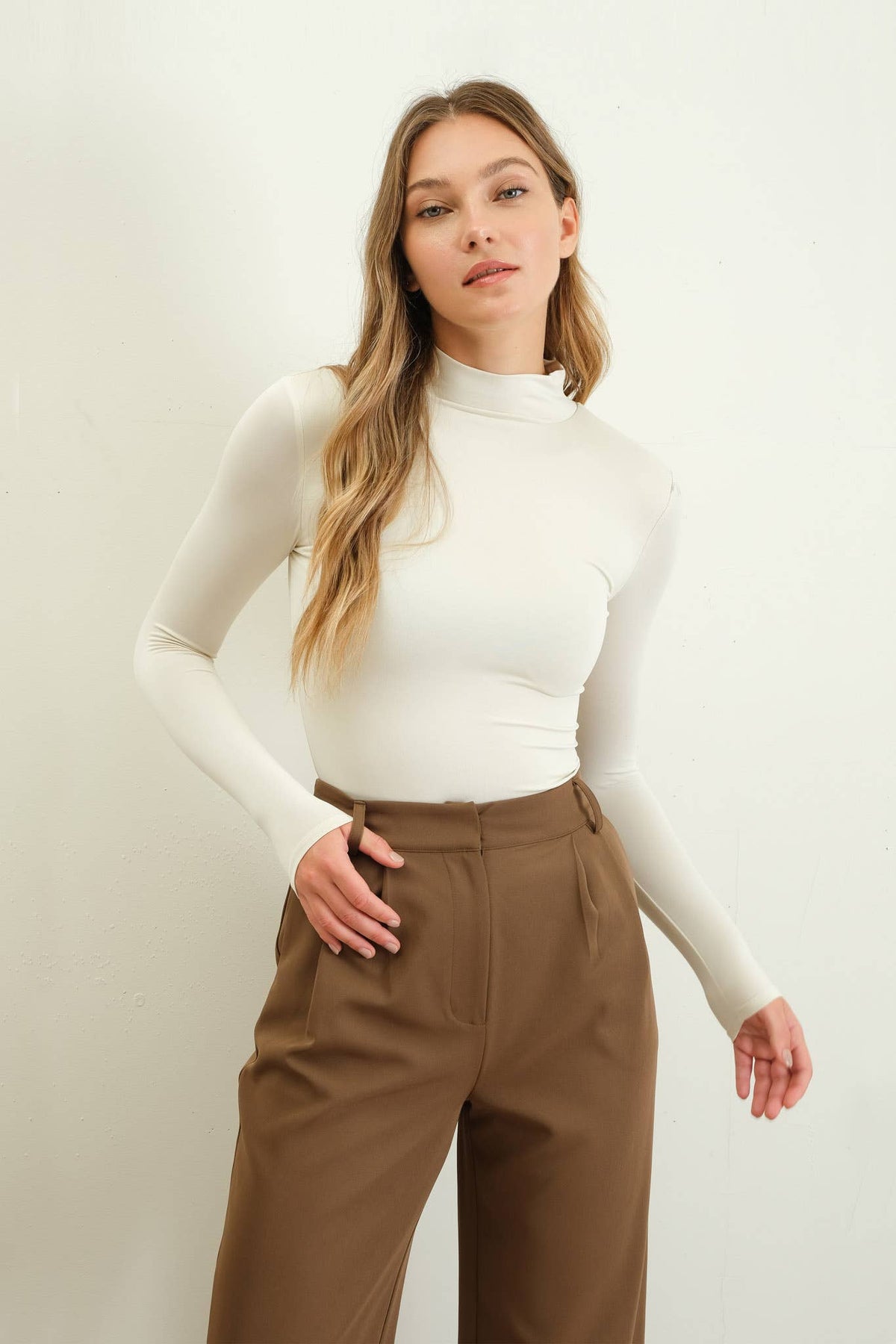 Wild Cactus Boutique Rae's Knit Top Bodysuit, close-up showing fitted knit fabric and scoop neckline.